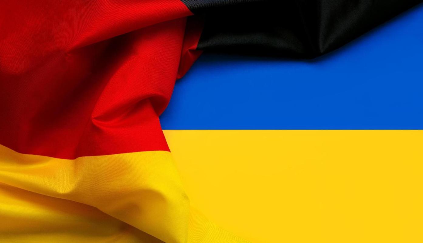 Die deutsche Flagge mit ukrainischer Flagge im Hintergrund. Quelle: esthermm/stock.adobe.com Die deutsche Flagge mit ukrainischer Flagge im Hintergrund. Quelle: esthermm/stock.adobe.com