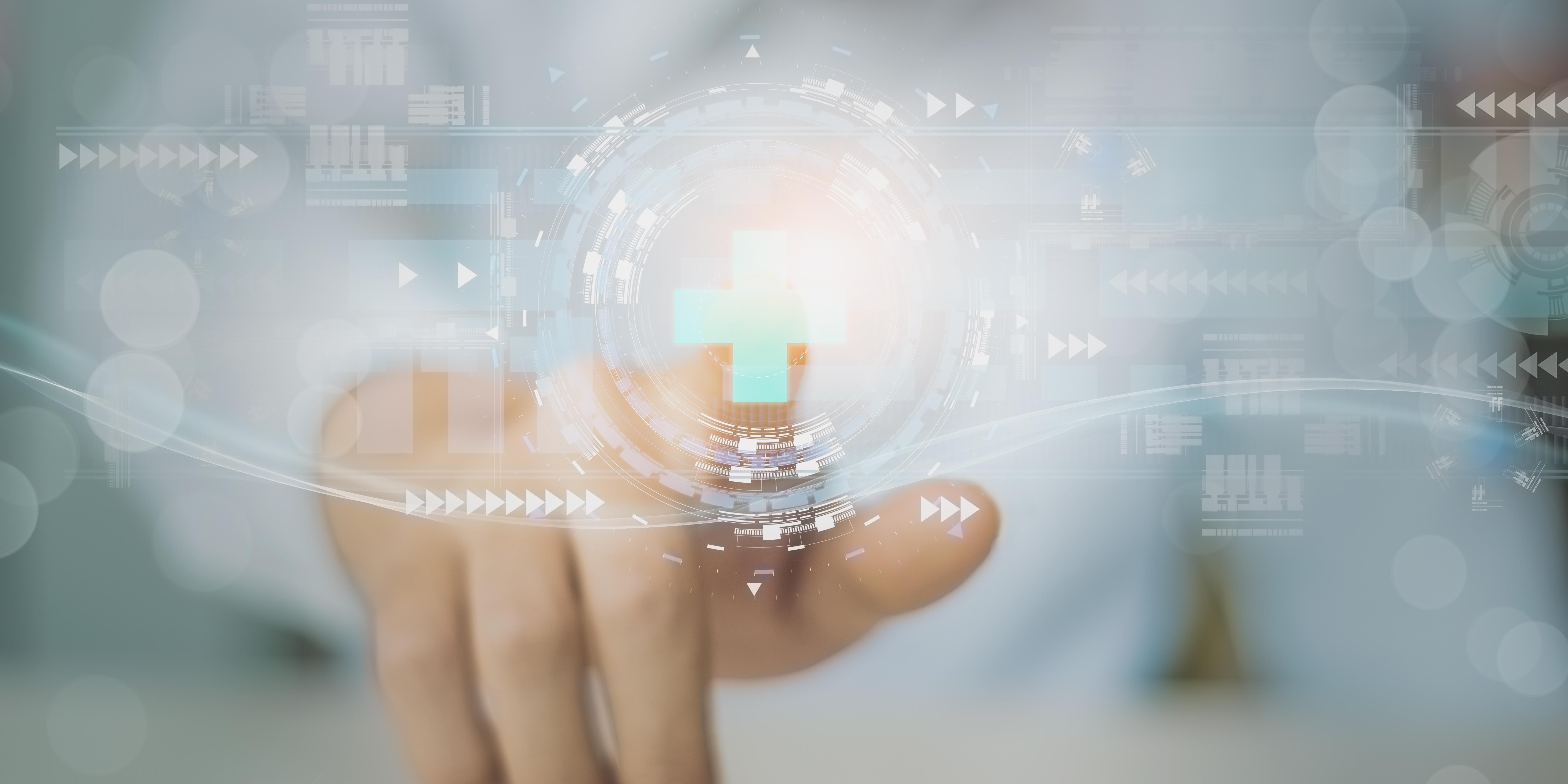 A person’s index finger touches a medical cross in the middle of a transparent screen from the other side. Image source: ART STOCK CREATIVE/stock.adobe.com. A person’s index finger touches a medical cross in the middle of a transparent screen from the other side. Image source: ART STOCK CREATIVE/stock.adobe.com.